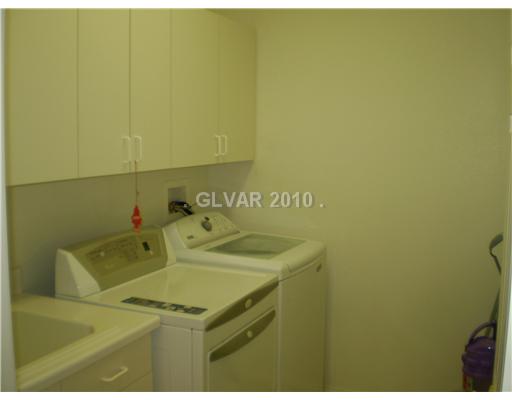 3736 Port Ritchey Street Las Vegas, NV 89147 - Photo 20 of 25 Other. Upstairs laundry room with sink and cabinets. Washer and dryer is not included in the price of the home but is negotiable with the seller