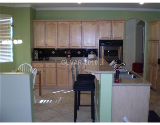 3736 Port Ritchey Street Las Vegas, NV 89147 - Photo 8 of 25 Kitchen. Kitchen is complete with a breakfast bar large enough for 4 stools