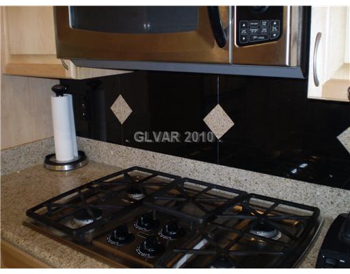 3736 Port Ritchey Street Las Vegas, NV 89147 - Photo 10 of 25 Kitchen. Cooktop stove with decorative backsplash