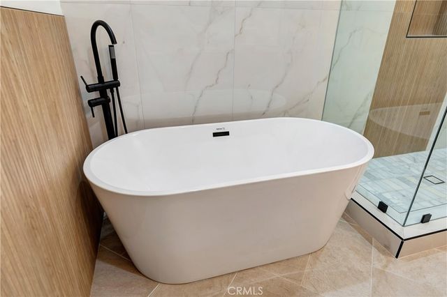 a view of a backyard with furniture porch and a garden