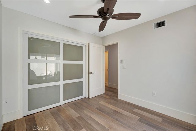 a view of a house with backyard sitting area and garden