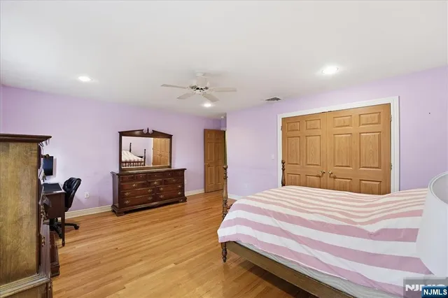 a bedroom with a bed and furniture