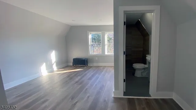 a bedroom with a bed and a closet