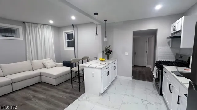 a kitchen with a sink stove and refrigerator