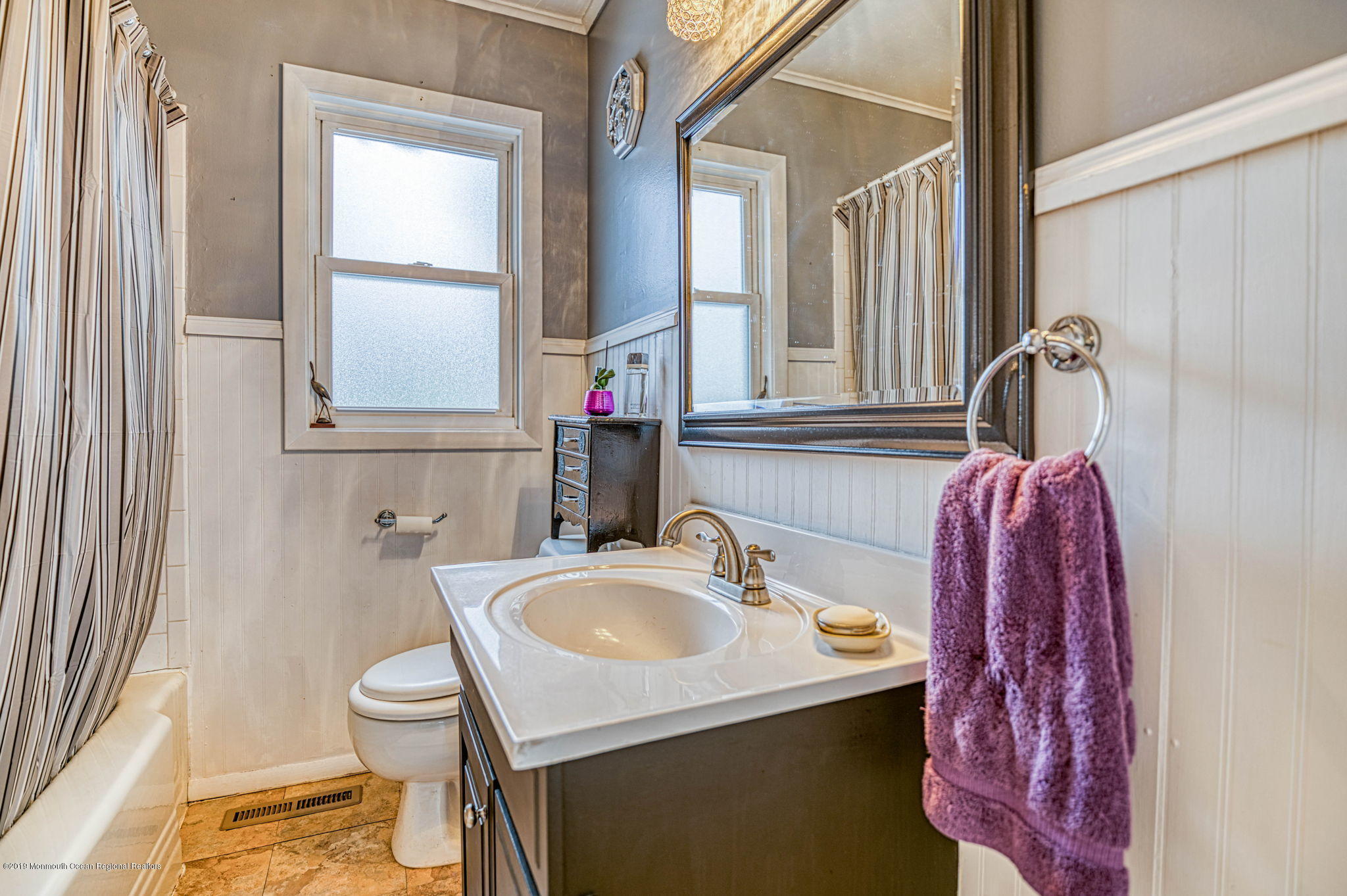 3210 Kickapoo Avenue Point Pleasant, NJ 08742 - Photo 11 of 16 a bathroom with a sink and a mirror
