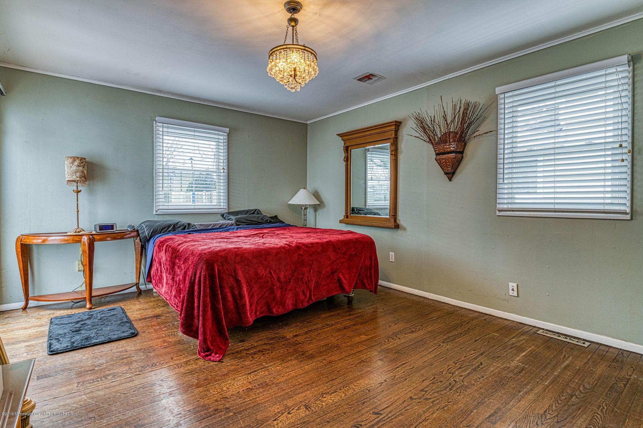 3210 Kickapoo Avenue Point Pleasant, NJ 08742 - Photo 9 of 16 a spacious bedroom with a bed wooden floor and window