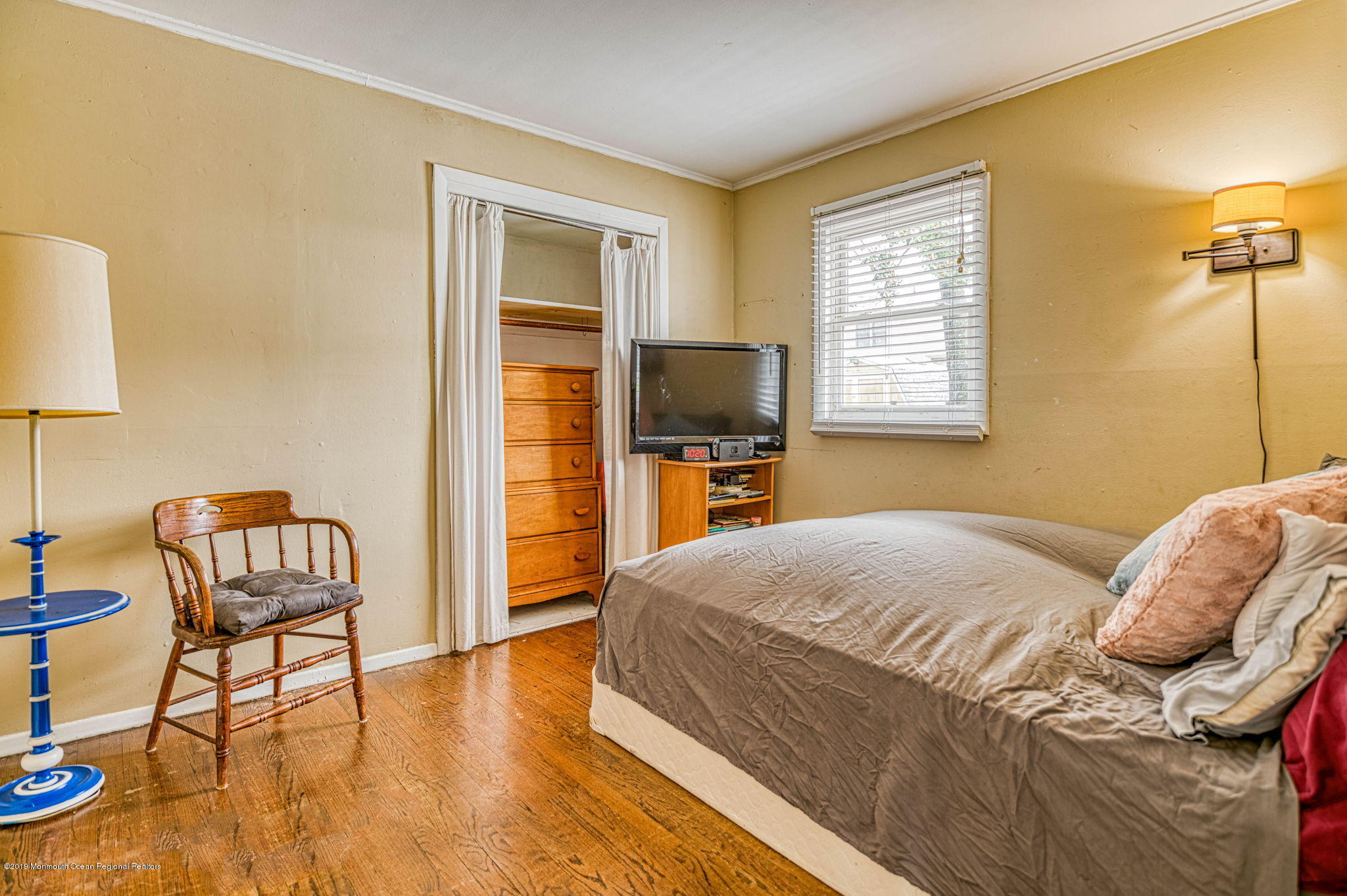 3210 Kickapoo Avenue Point Pleasant, NJ 08742 - Photo 10 of 16 a bedroom with a bed and a chair in it