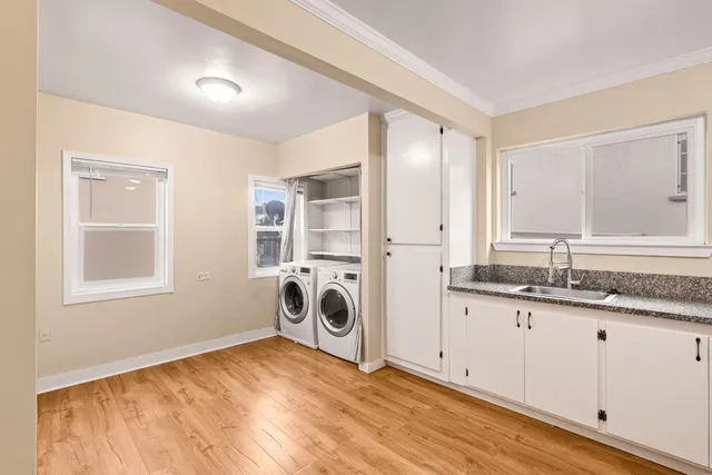 a view of a kitchen with a sink and a window