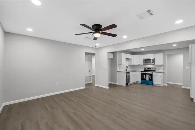 a view of a kitchen with a sink and a window