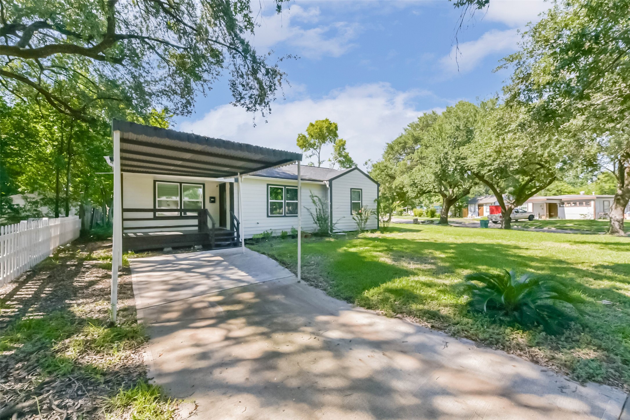 1102 West Hart Avenue Pasadena, TX 77506 - Photo 2 of 40 a front view of a house with a yard