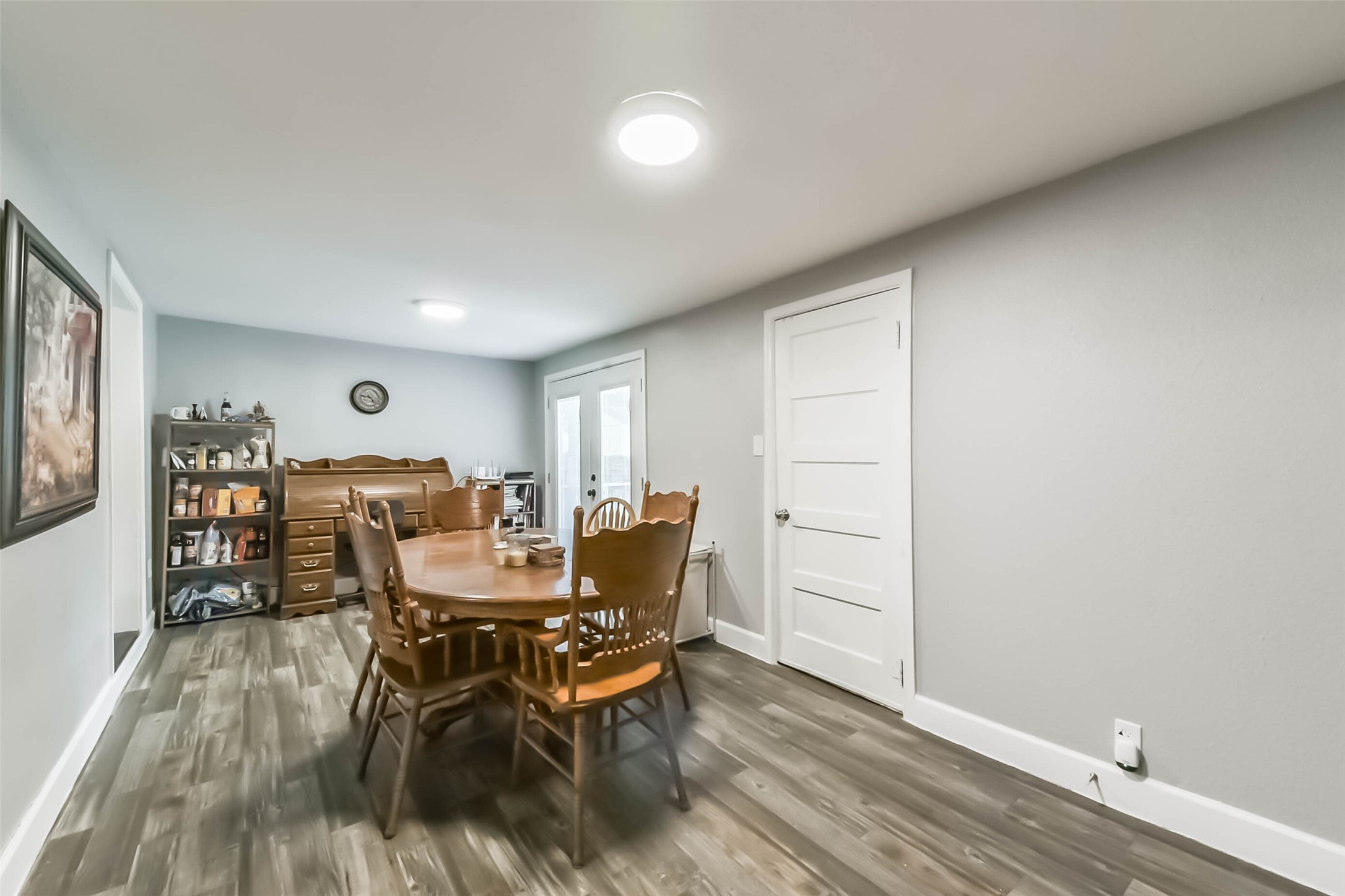 1102 West Hart Avenue Pasadena, TX 77506 - Photo 27 of 40 a view of a dining room with furniture and wooden floor