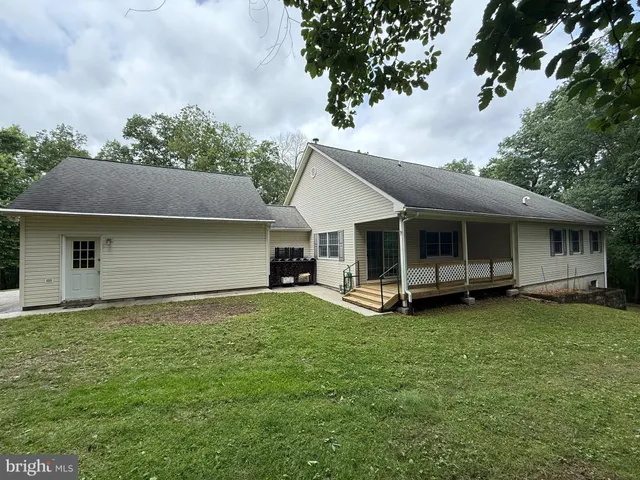 a view of a hall with wooden floor