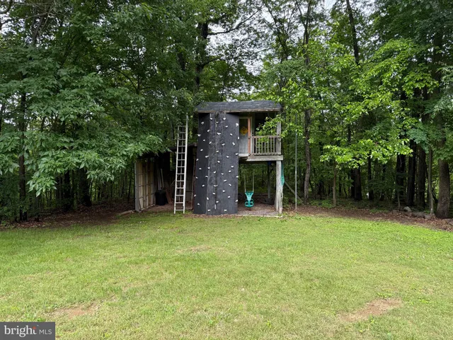 a view of a road with trees in the background