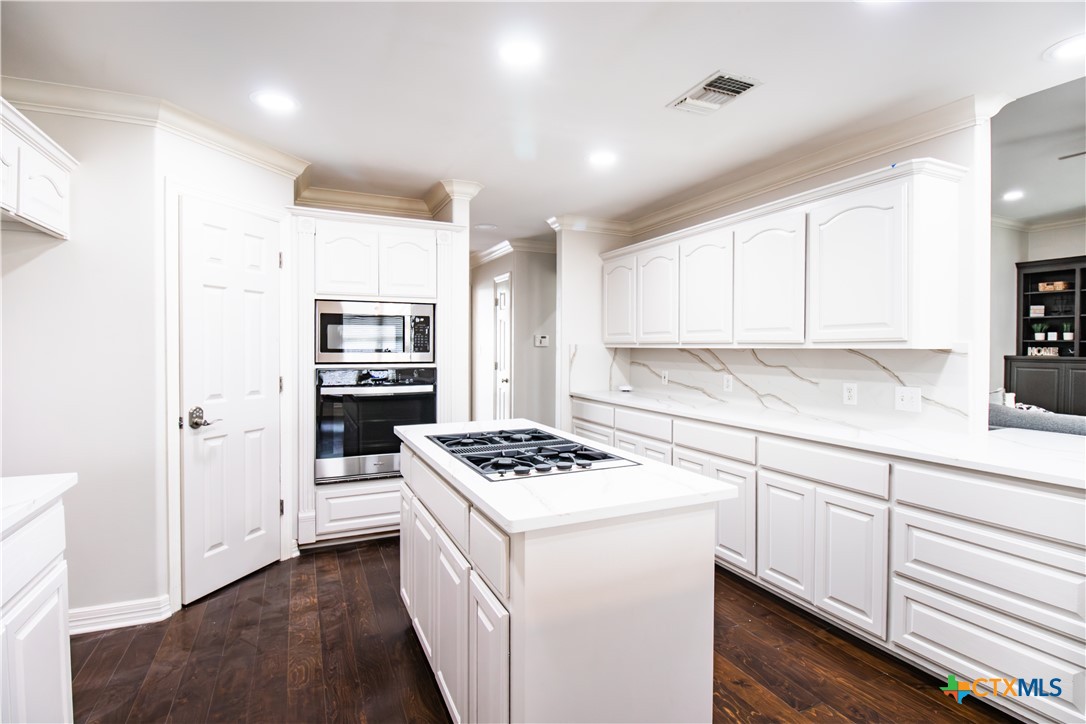202 Ridge View Victoria, TX 77904 - Photo 16 of 41 a kitchen with stainless steel appliances a stove a sink and a refrigerator