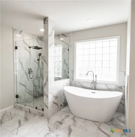 a view of a house with a ceiling fan and a large window