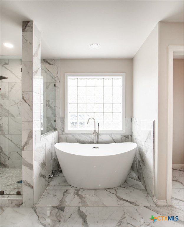 202 Ridge View Victoria, TX 77904 - Photo 26 of 41 a white bath tub sitting in a spacious bathroom next to a window