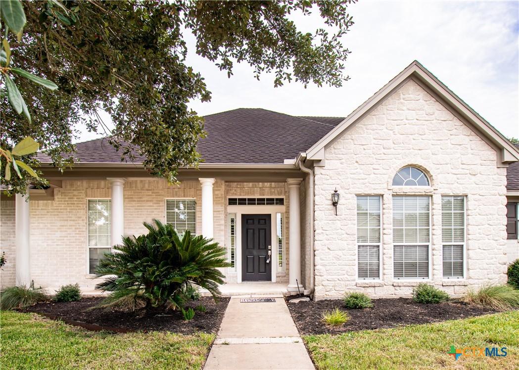 202 Ridge View Victoria, TX 77904 - Photo 3 of 41 a front view of a house with a yard and potted plants