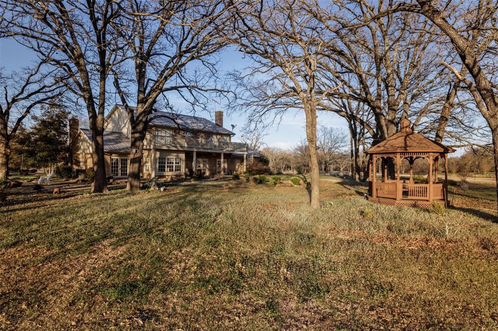 6569 Fm 2947, Unit 4 Quinlan, TX 75474 - Photo 11 of 37 a view of yard with trees