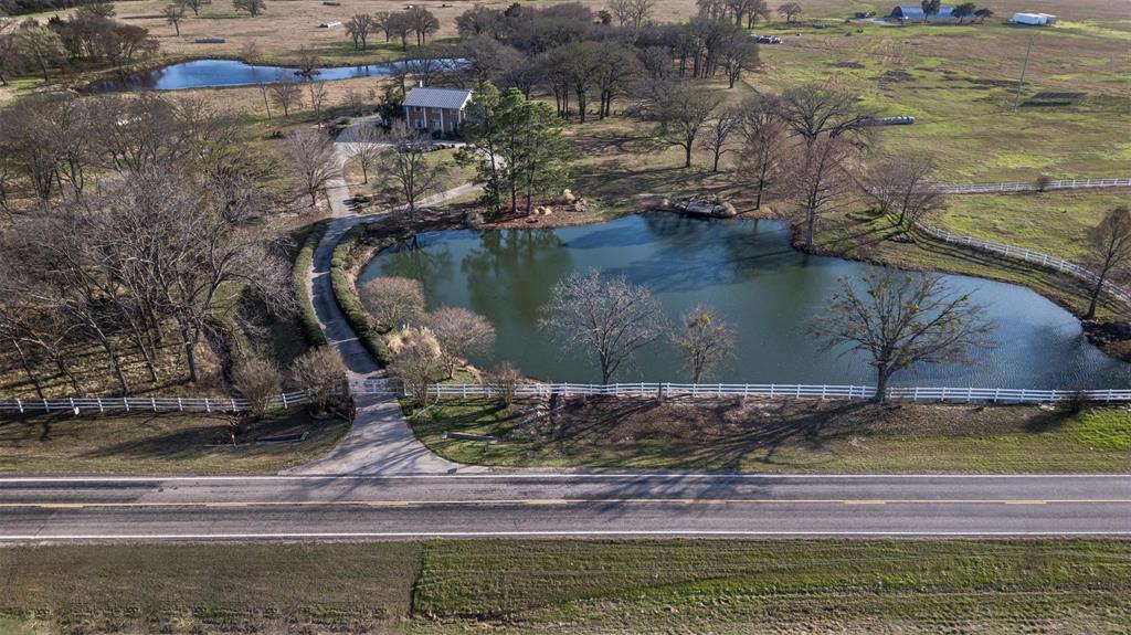 6569 Fm 2947, Unit 4 Quinlan, TX 75474 - Photo 12 of 37 a view of a lake from a yard