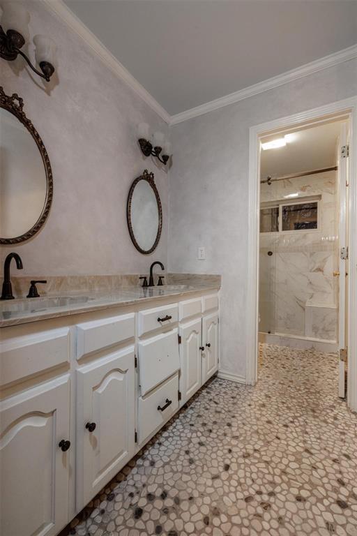 6569 Fm 2947, Unit 4 Quinlan, TX 75474 - Photo 16 of 37 a bathroom with a double vanity sink mirror and shower