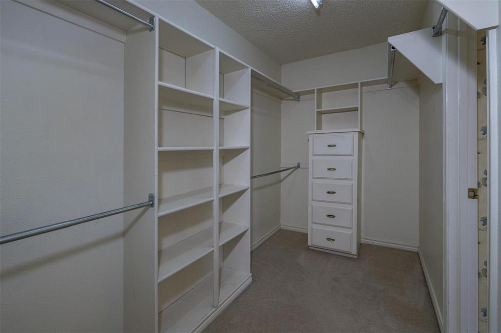 6569 Fm 2947, Unit 4 Quinlan, TX 75474 - Photo 18 of 37 a view of walk in closet with empty racks