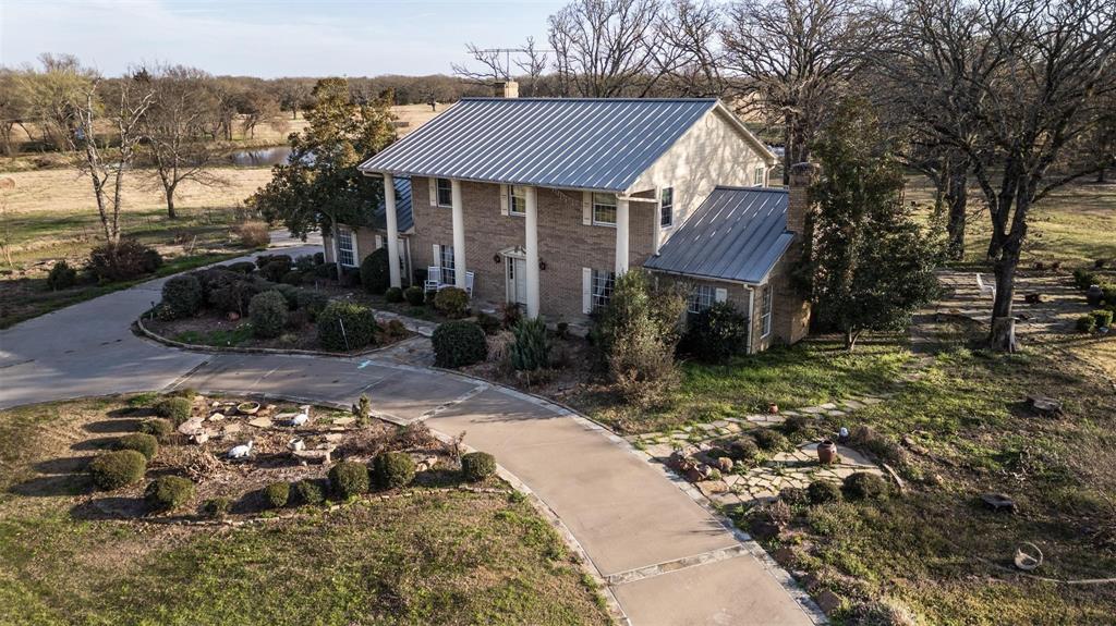 6569 Fm 2947, Unit 4 Quinlan, TX 75474 - Photo 2 of 37 a front view of a house with a yard