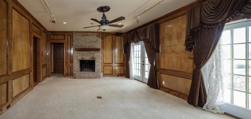 6569 Fm 2947, Unit 4 Quinlan, TX 75474 - Photo 25 of 37 a view of empty room with a fireplace