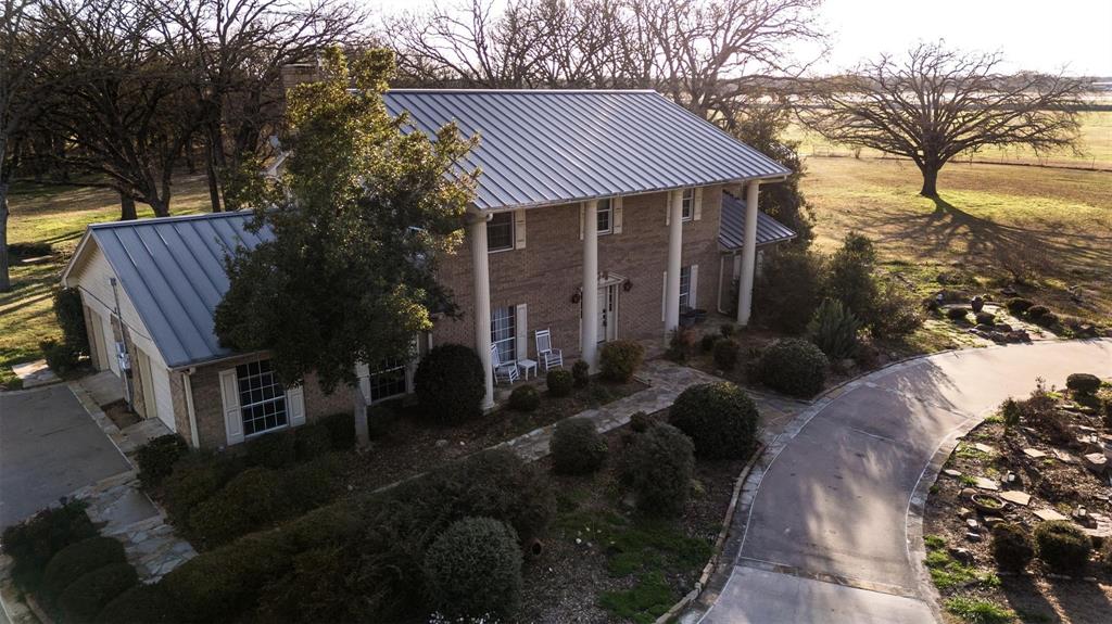 6569 Fm 2947, Unit 4 Quinlan, TX 75474 - Photo 5 of 37 a front view of a house with garden