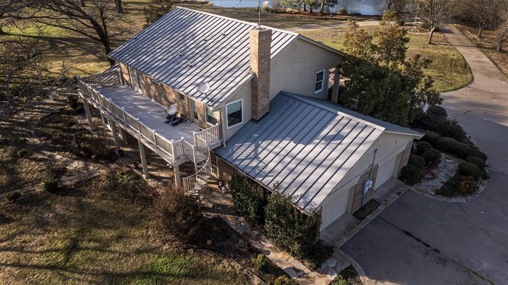6569 Fm 2947, Unit 4 Quinlan, TX 75474 - Photo 8 of 37 a view of balcony with wooden fencing