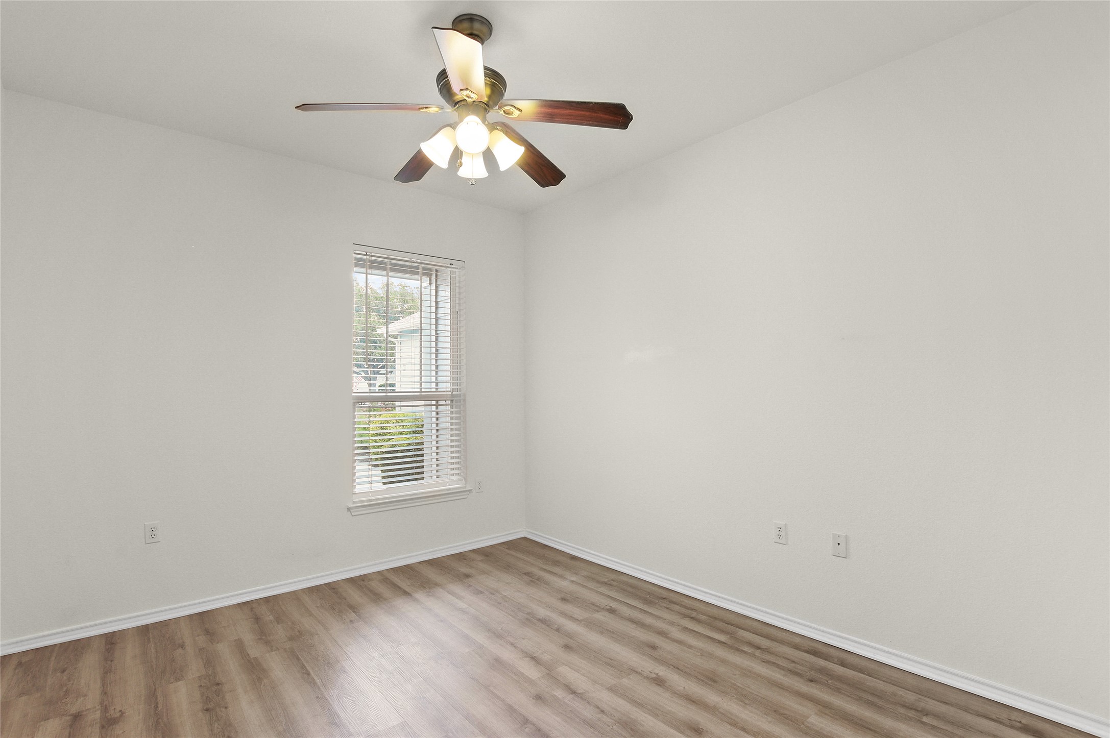 119 Hampton Circle Georgetown, TX 78633 - Photo 20 of 28 Empty room featuring light wood-style floors and a ceiling fan