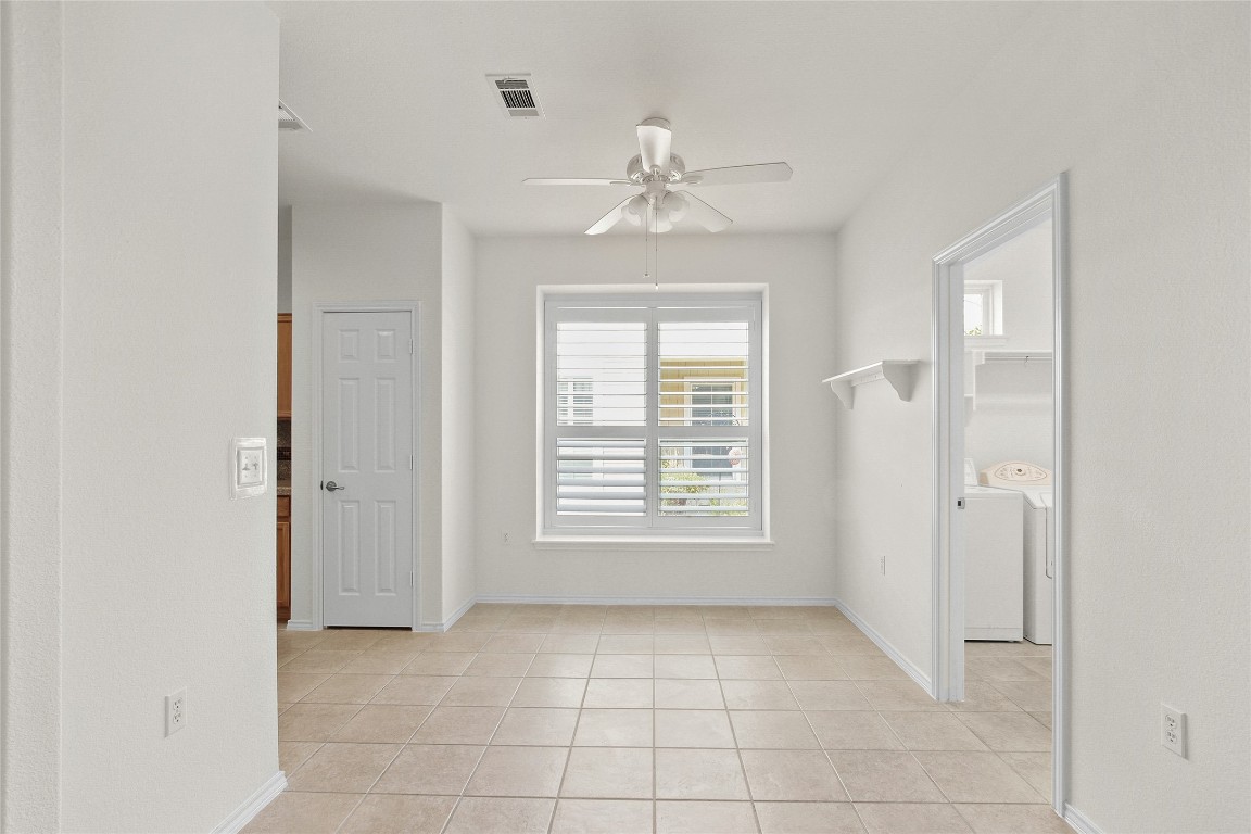 119 Hampton Circle Georgetown, TX 78633 - Photo 10 of 28 Spare room with light tile patterned floors and ceiling fan