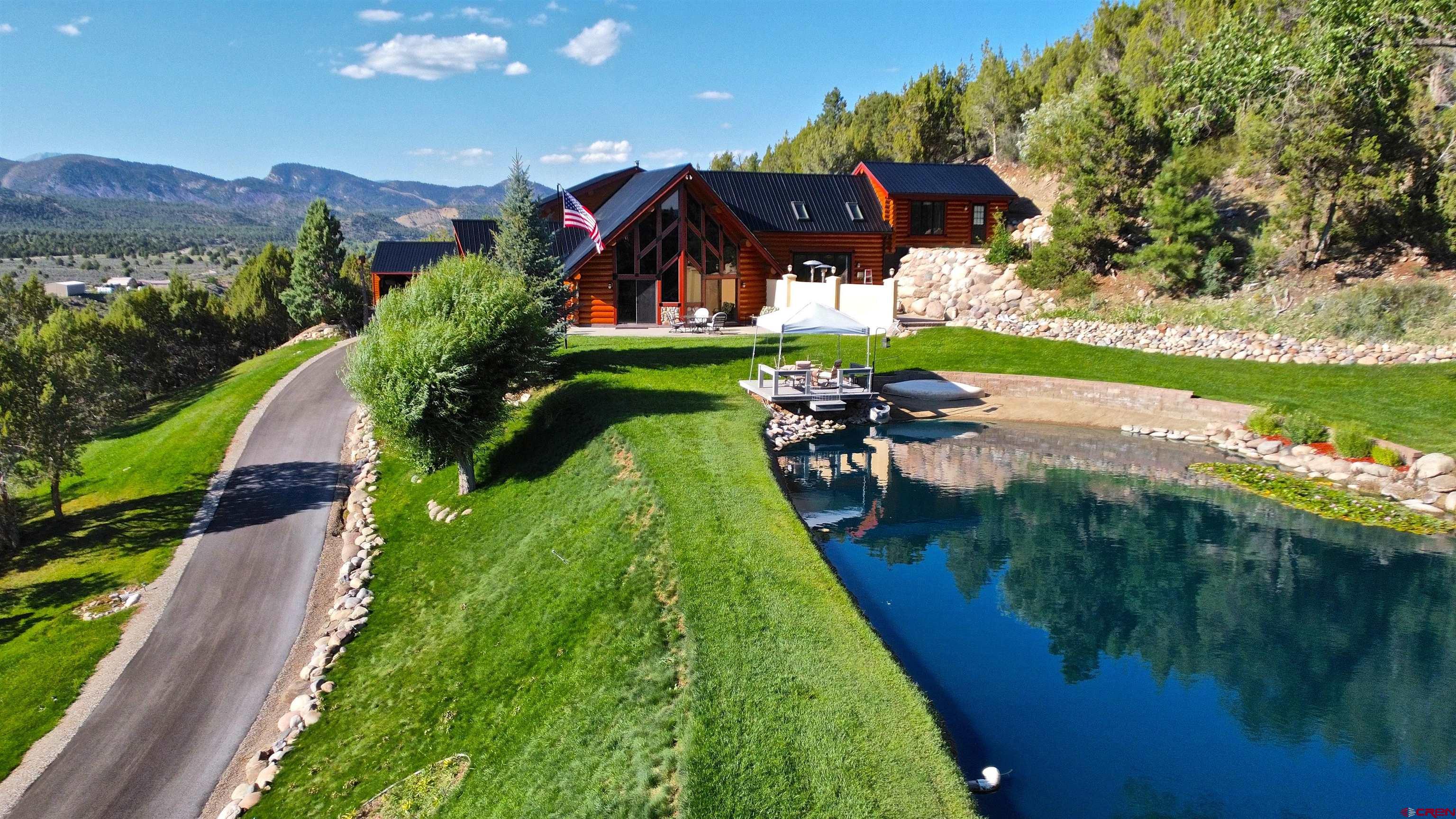 422 North Rainbow Road Durango, CO 81303 - Photo 1 of 34 a view of a lake with a yard