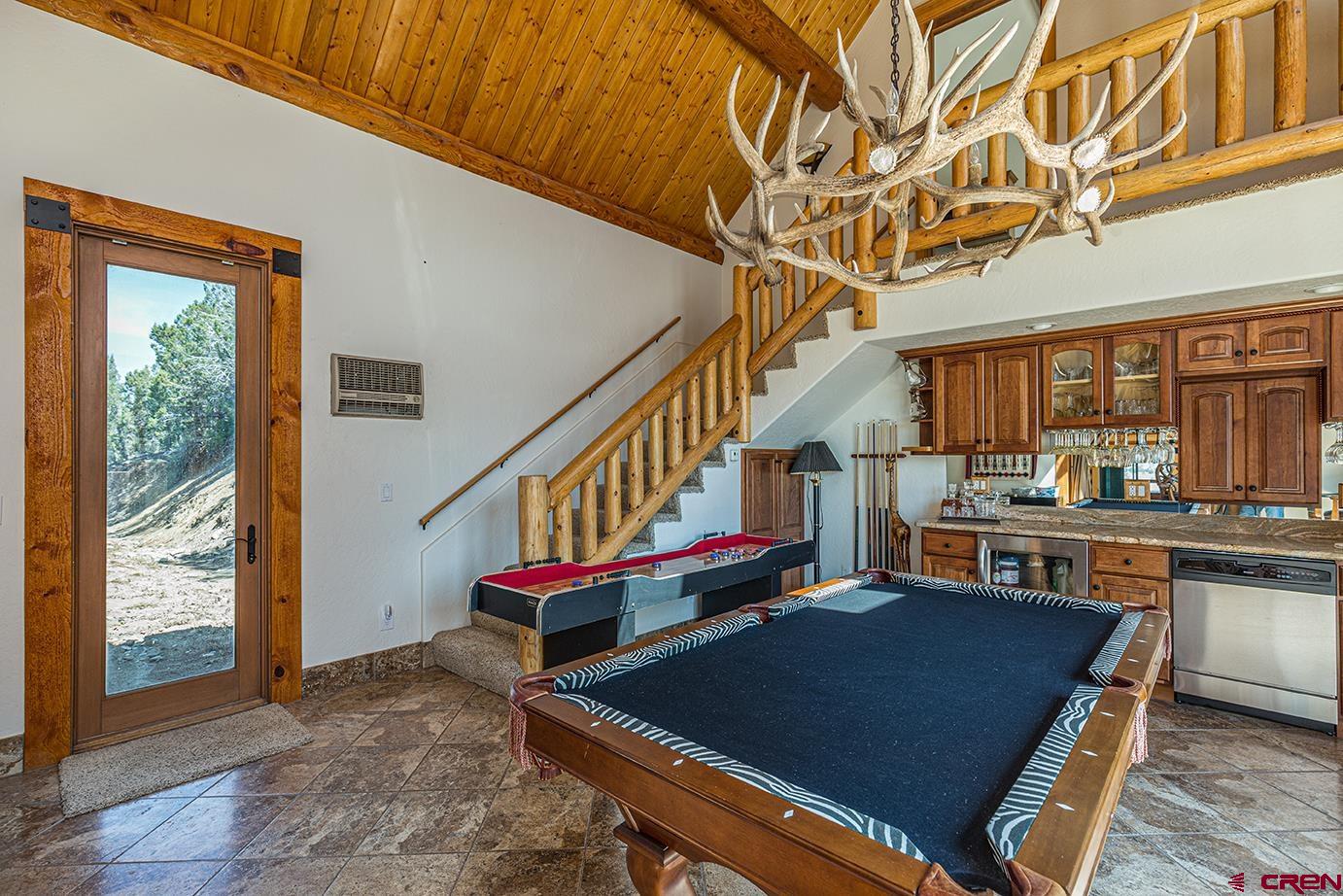 422 North Rainbow Road Durango, CO 81303 - Photo 21 of 34 a living room with furniture pool table and chandelier
