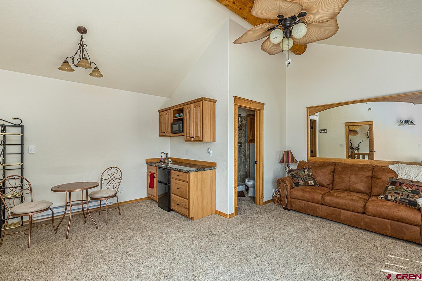 422 North Rainbow Road Durango, CO 81303 - Photo 23 of 34 a living room with furniture and a chandelier