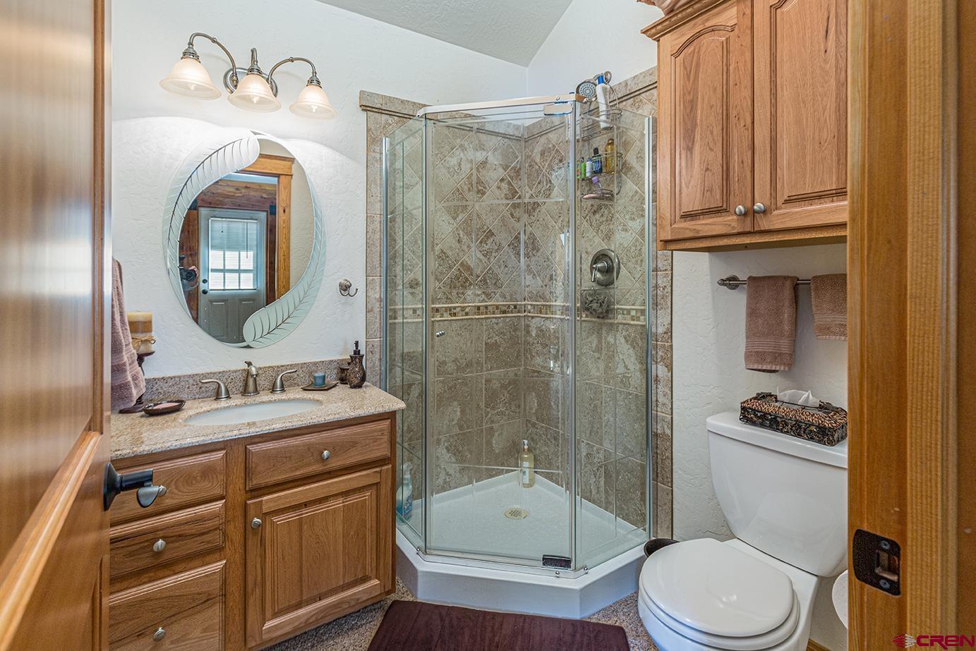 422 North Rainbow Road Durango, CO 81303 - Photo 25 of 34 a bathroom with a sink a toilet and shower