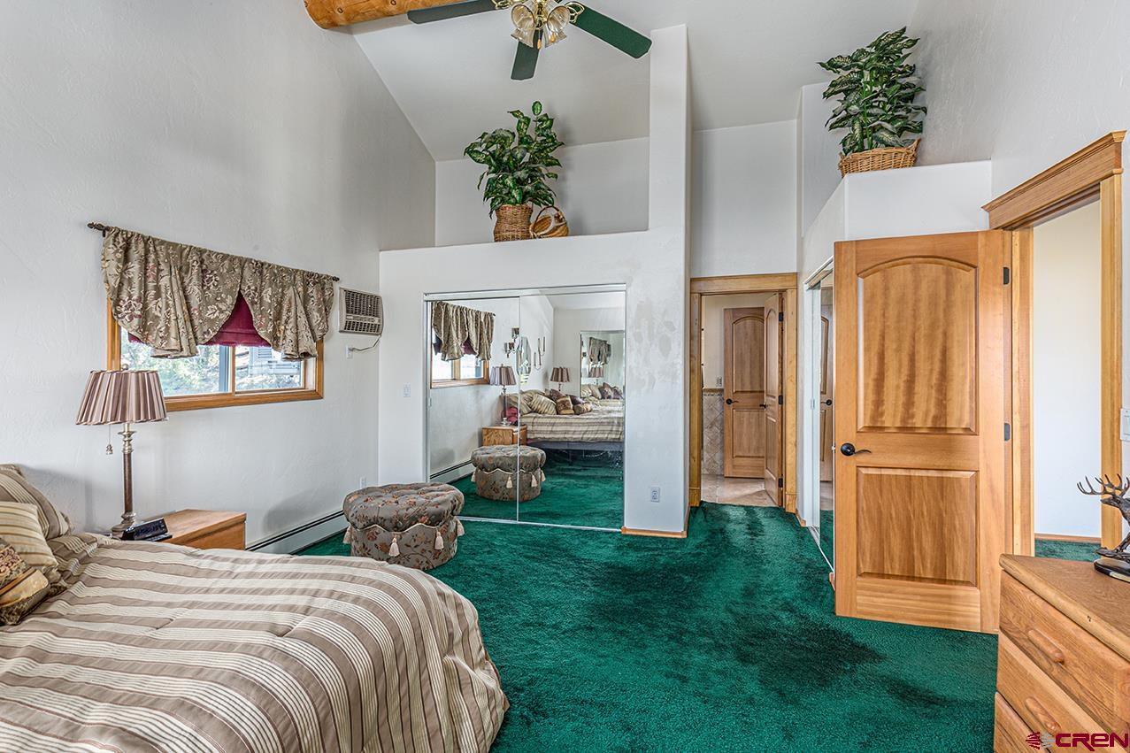 422 North Rainbow Road Durango, CO 81303 - Photo 33 of 34 a bedroom with bed and flowerpot