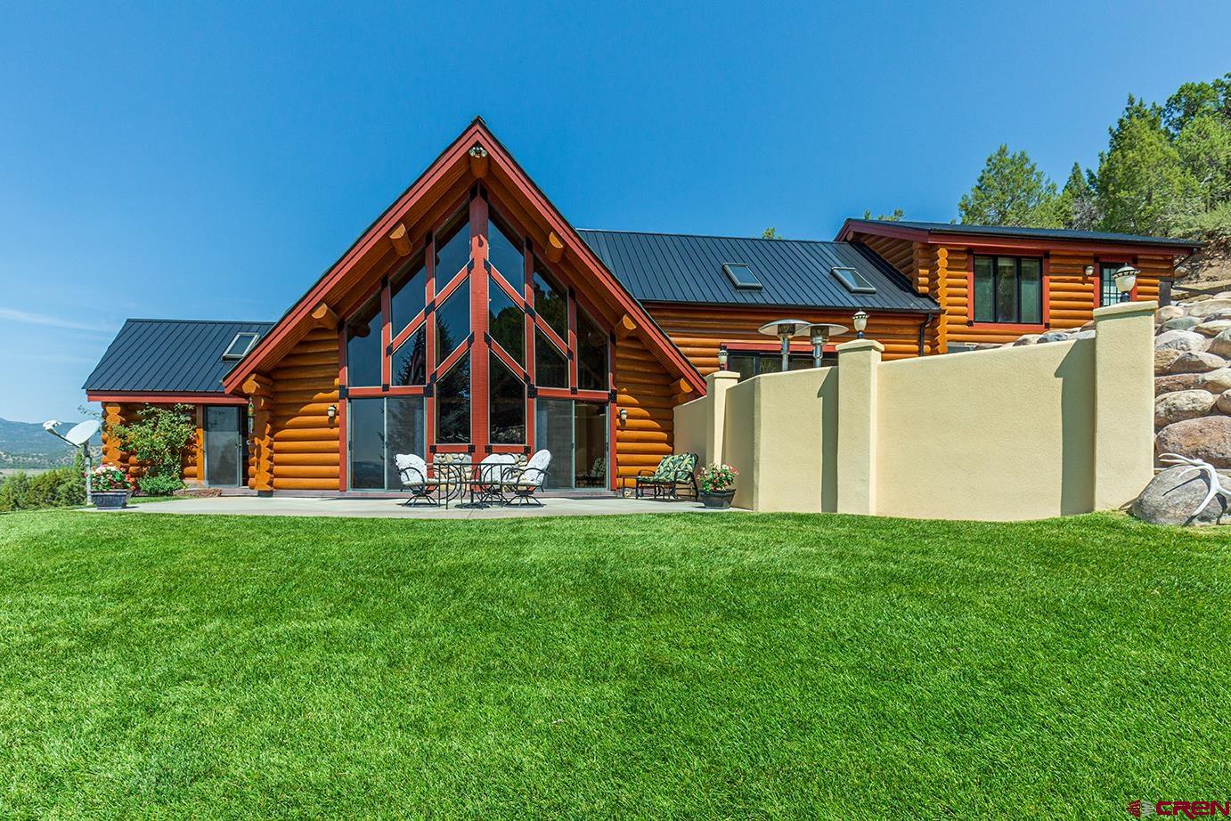 422 North Rainbow Road Durango, CO 81303 - Photo 6 of 34 a view of a house with a yard and deck