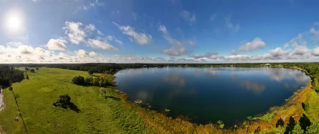 a view of a lake in middle of the house