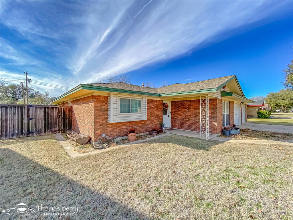 1104 Hickory Street Roscoe, TX 79545 - Photo 2 of 22 a view of a house with backyard and sitting area