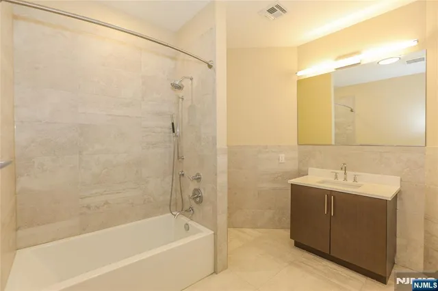 a bathroom with a bathtub and a sink