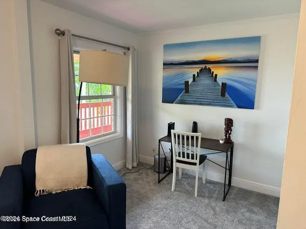 a bedroom with furniture and a window