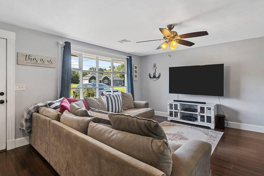 266 Bushee Road Swansea, MA 02777 - Photo 12 of 33 a living room with furniture and a flat screen tv