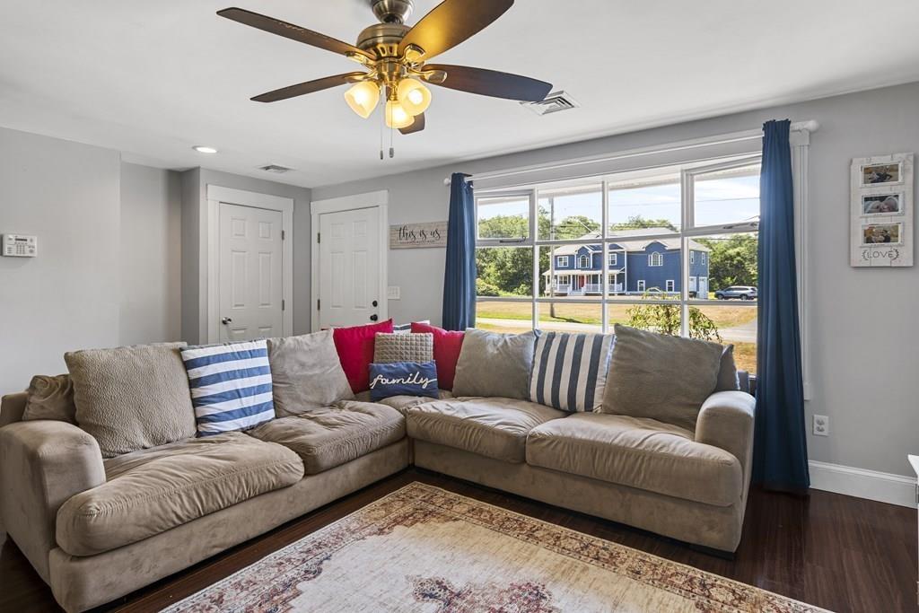 266 Bushee Road Swansea, MA 02777 - Photo 13 of 33 a living room with furniture and a large window