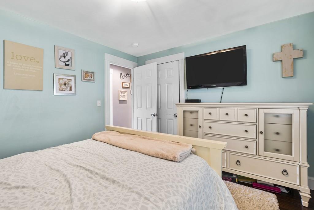 266 Bushee Road Swansea, MA 02777 - Photo 15 of 33 a bedroom with a bed a flat screen tv and a dresser