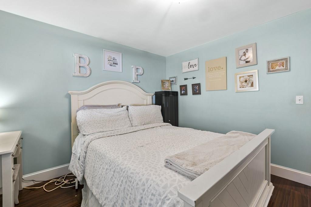 266 Bushee Road Swansea, MA 02777 - Photo 16 of 33 a bedroom with a bed and painting on the wall