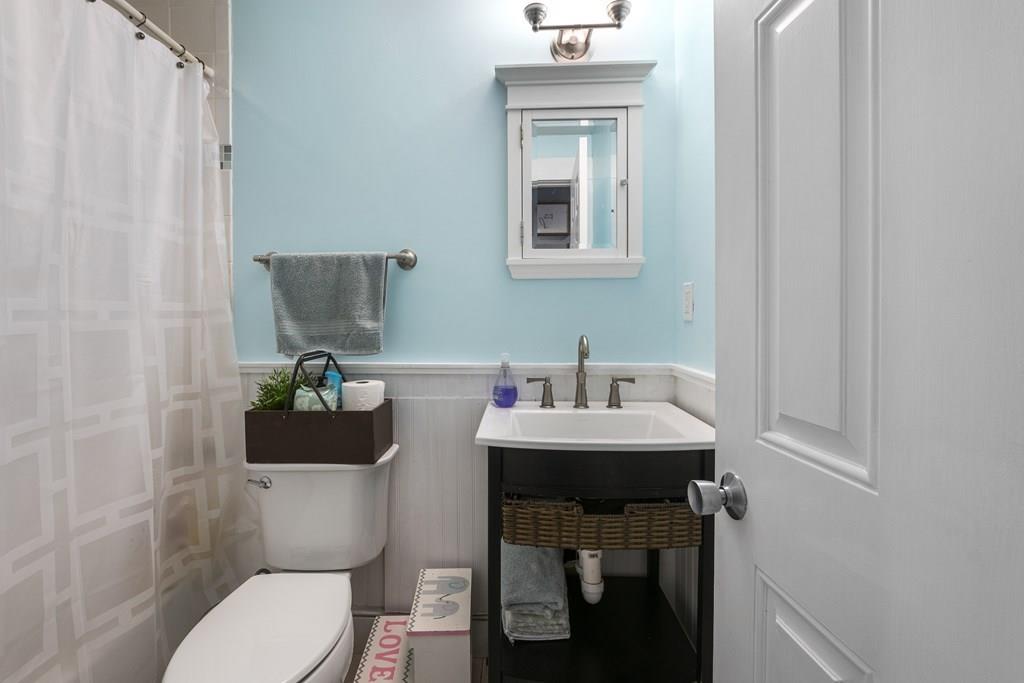 266 Bushee Road Swansea, MA 02777 - Photo 20 of 33 a bathroom with a toilet a sink and mirror