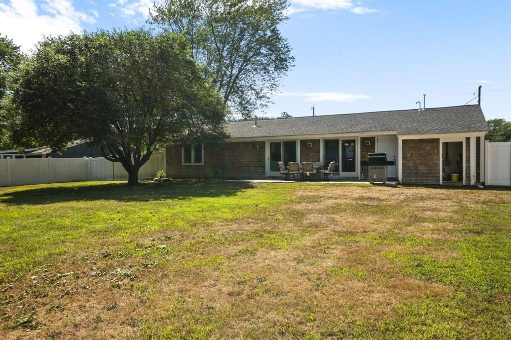 266 Bushee Road Swansea, MA 02777 - Photo 27 of 33 a front view of house with yard and swimming pool