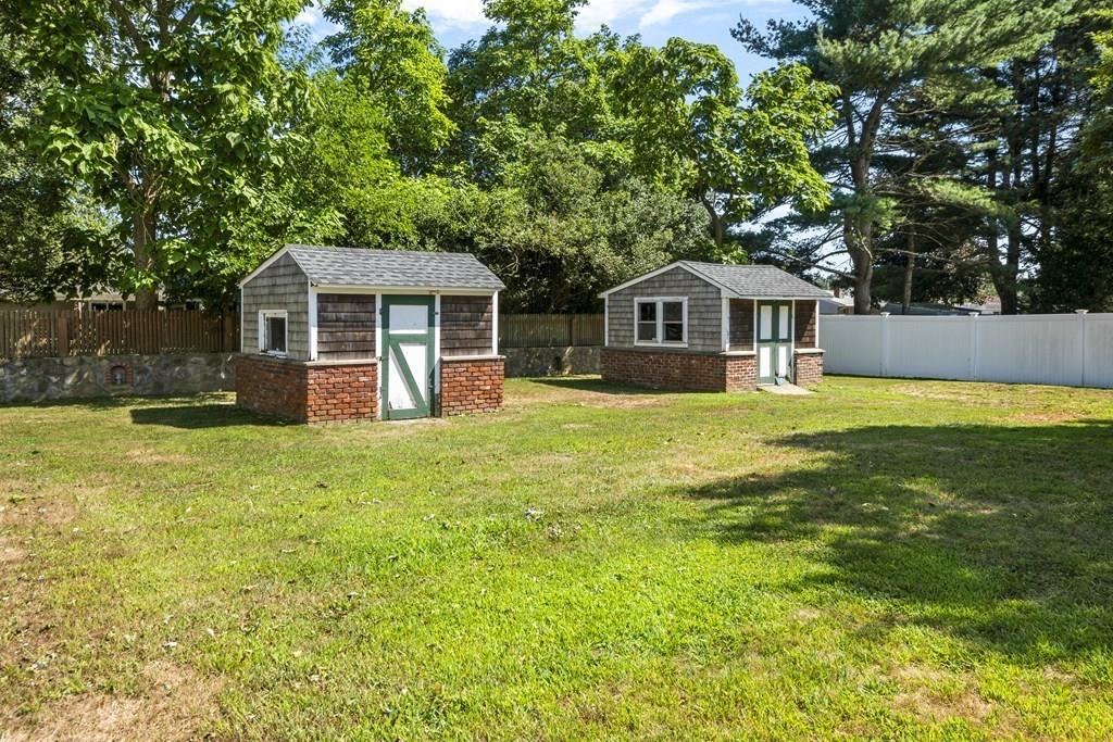 266 Bushee Road Swansea, MA 02777 - Photo 30 of 33 a front view of a house with a yard and trees