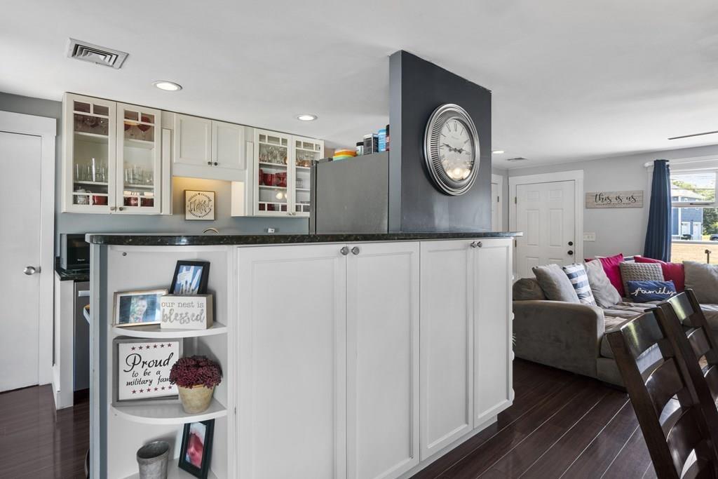 266 Bushee Road Swansea, MA 02777 - Photo 7 of 33 a living room with furniture and a clock