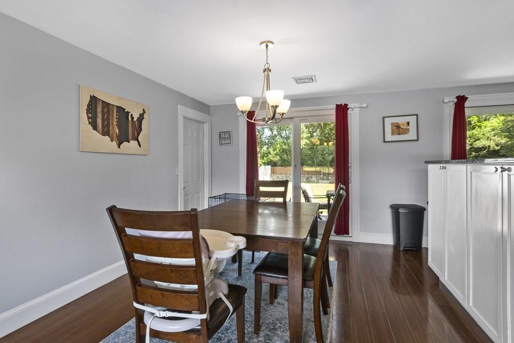 266 Bushee Road Swansea, MA 02777 - Photo 9 of 33 a view of a dining room with furniture window and wooden floor